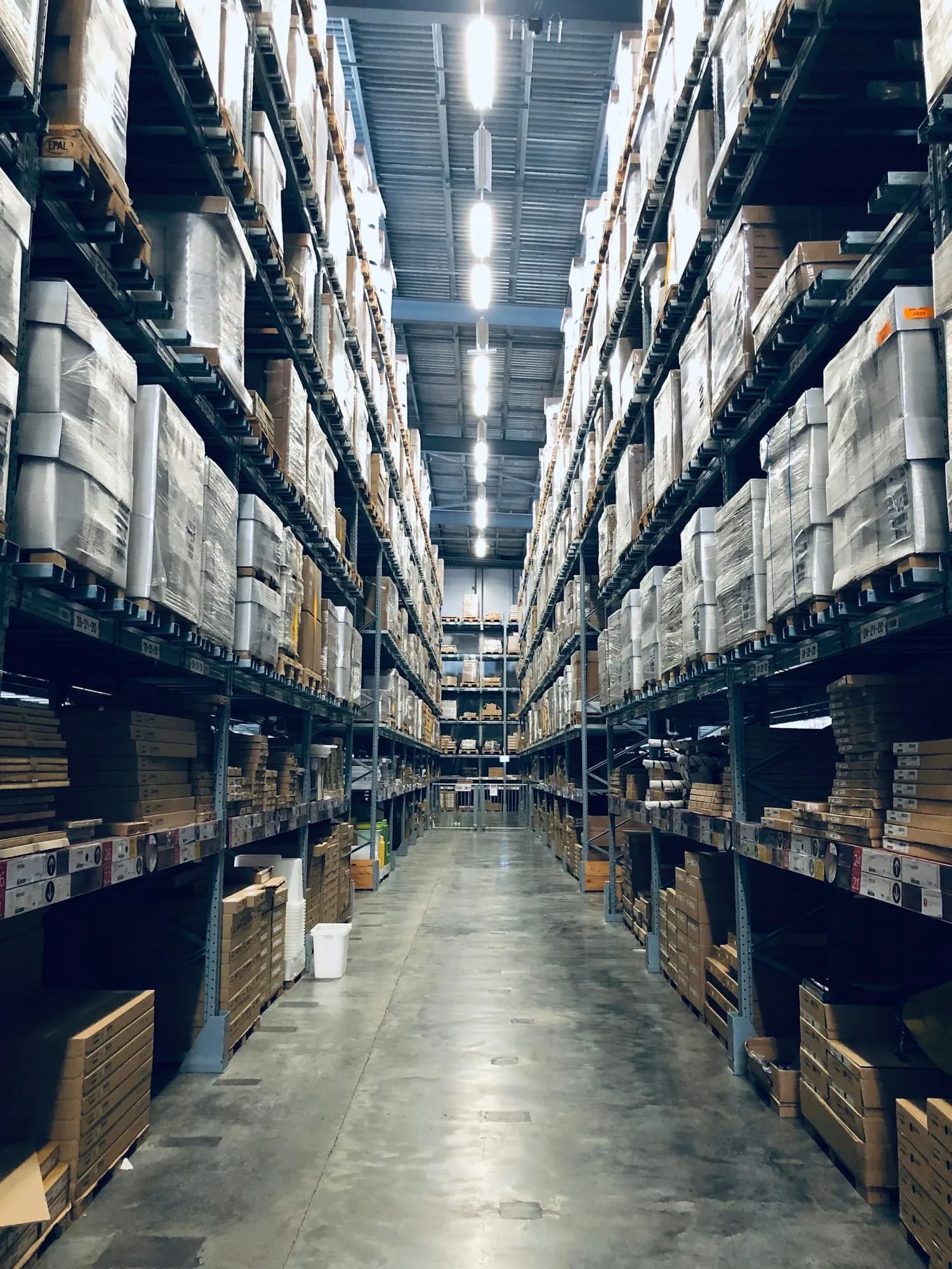 A view through a modern warehouse aisle